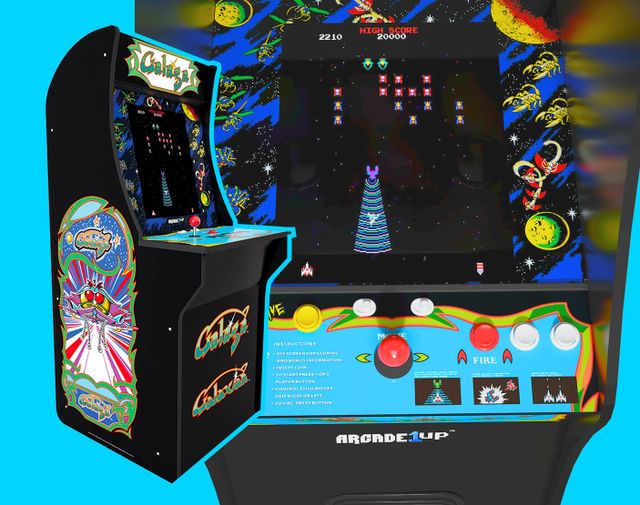 Two photos of the original Galaga arcade cabinet