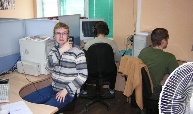 Three KraiSoft team members are at work
